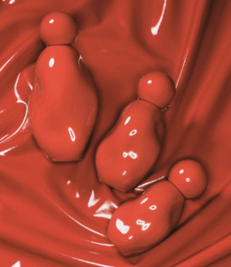 Flacon du parfum Cosmic Intense de Kylie Cosmetics au design sculptural rouge intense